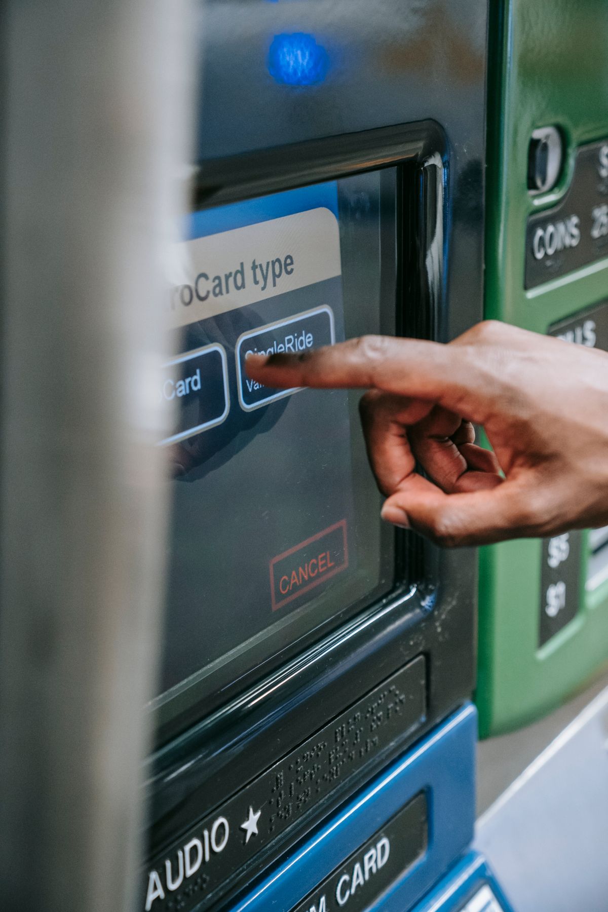 A person using an ATM touchscreen