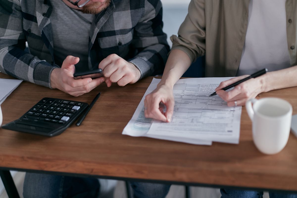 A couple reviewing household finances at home