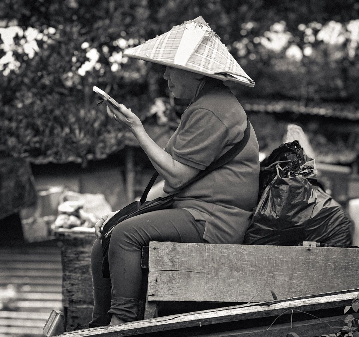 An older woman using a smartphone in Malaysia