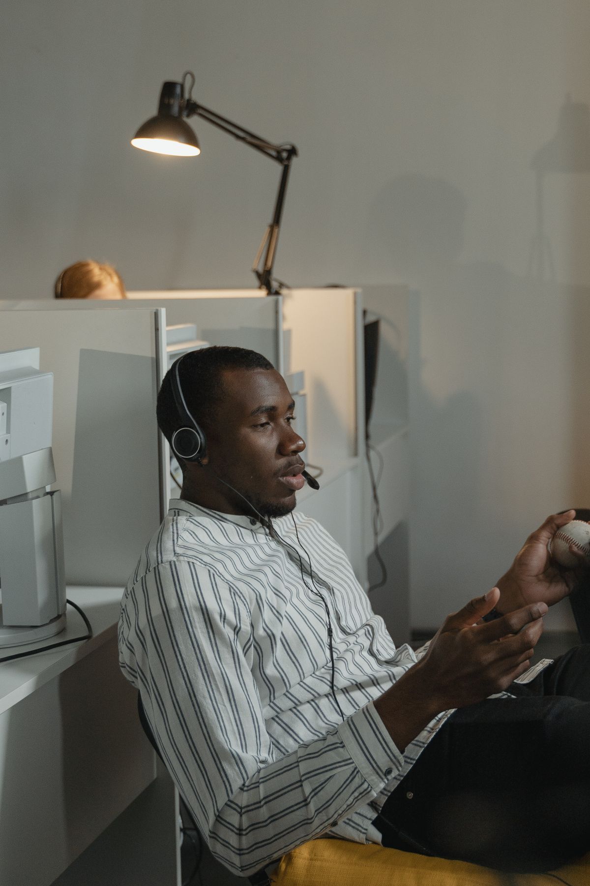 A support agent speaking to a customer by headset