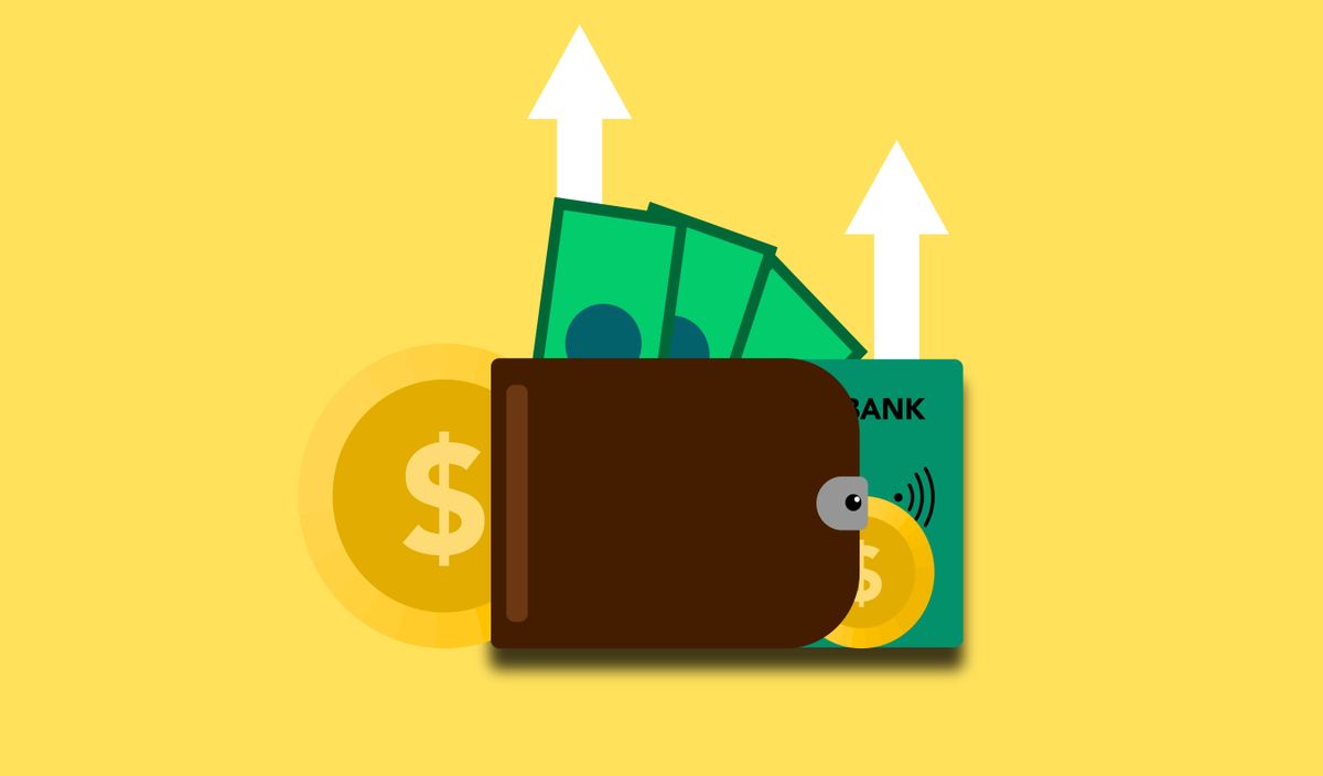 A wallet, payment card and money arranged for budgeting